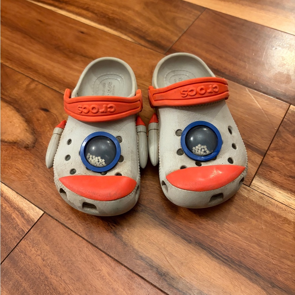 CROCS Kids Gray Clogs with Orange Accents and Blue Character Eyes